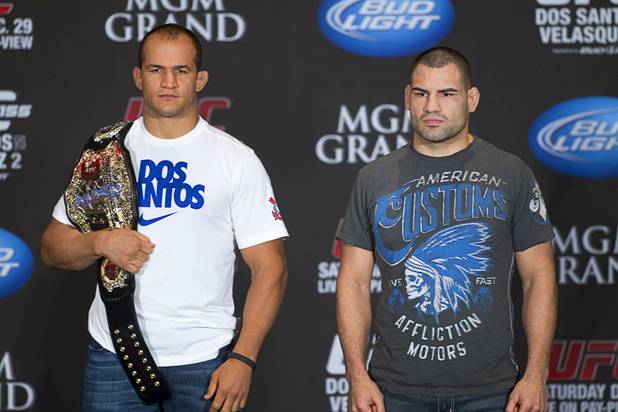 UFC heavyweight champion Junior Dos Santos, left, of Brazil and Cain Velasquez of San Jose, Calif., pose during a news conference at the MGM Grand on Thursday, Dec. 27, 2012. Dos Santos will defend the title against Velasquez on Saturday at UFC 155 at the MGM Grand Garden Arena.