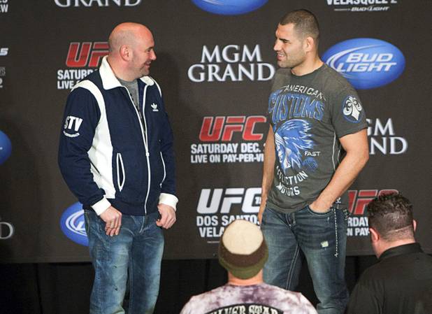 UFC president Dana White, left, talks with former heavyweight champion Cain Velasquez of San Jose, Calif. during a news conference at the MGM Grand Thursday, Dec. 27, 2012. Velasquez will try and reclaim his title from heavyweight champion Junior Dos Santos of Brazil during UFC155 at the MGM Grand Garden Arena Saturday.