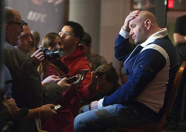 UFC president Dana White listens to a question from reporter Kevin Iole, left, at the conclusion of a news conference at the MGM Grand Thursday, Dec. 27, 2012. Heavyweight champion Junior Dos Santos of Brazil will defend the title against former champion Cain Velasquez of San Jose, Calif. during UFC155 at the MGM Grand Garden Arena Saturday.