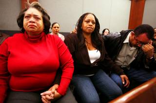 Claudette Flanagan-Jones, from left, Jade Morris' grandmother, Tejuana Reeves-Morris, Jade's mother, and Andres Mack, Jade's grandfather, watch as Brenda Stokes appears in Las Vegas Justice Court for a hearing Friday, Dec. 28, 2012, at the Regional Justice Center.