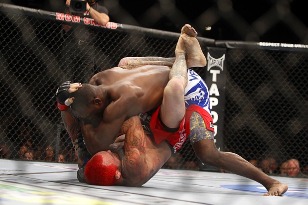 Chris Leben, left, of Oahu, Hawaii is taken down by Derek Brunson of Wilmington, N.C. during a middleweight bout UFC155 at the MGM Grand Garden Arena Saturday, Dec. 29, 2012. Brunson won by unanimous decision.