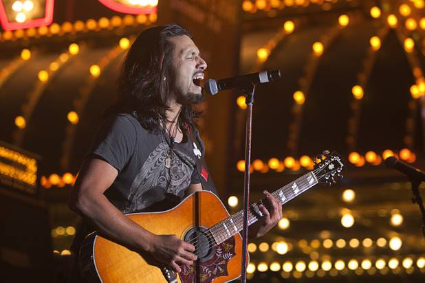Pop Evil lead vocalist Leigh Kakaty performs during the New Years Eve party at the Fremont Street Experience Monday, Dec. 31, 2012.