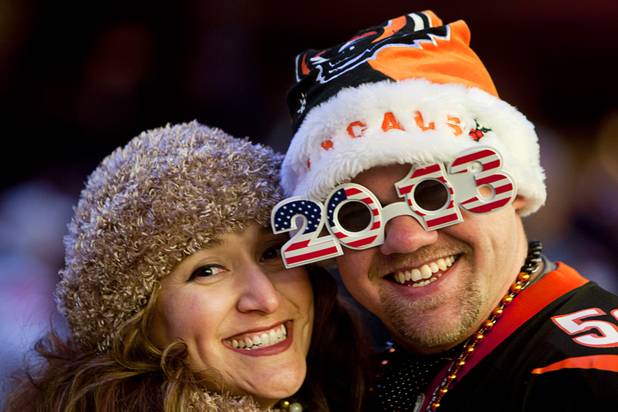 Genevieve Acosta and Joey Purcell of Phoenix, Ariz. pose during the New Years Eve party at the Fremont Street Experience Monday, Dec. 31, 2012.