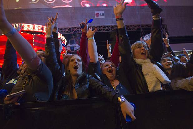 Guests listen to Jizzy Pearl during the New Years Eve party at the Fremont Street Experience Monday, Dec. 31, 2012.