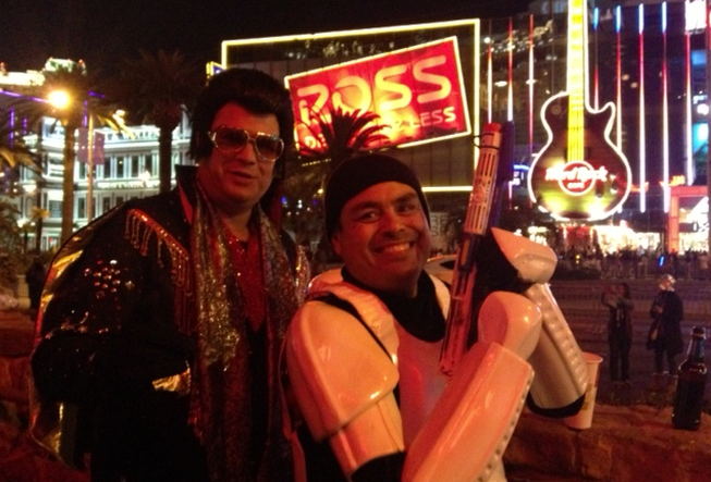 Brett Essenmacher, as Elvis, and Ephriam Gonzalez, as a Star Wars storm trooper, stopped for a cigarette and a beer outside El Diablo bar and grill near the Monte Carlo. "I heard you can make a lot of money out here on New Year's Eve, so I thought I'd give it a try," Gonzalez said.