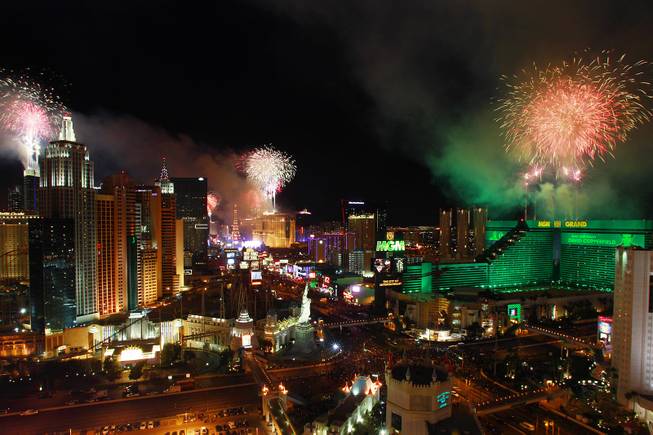 Fireworks explode from the tops of casinos on the Strip during the annual New Year's Eve celebration in Las Vegas Tuesday, Jan.1, 2013.