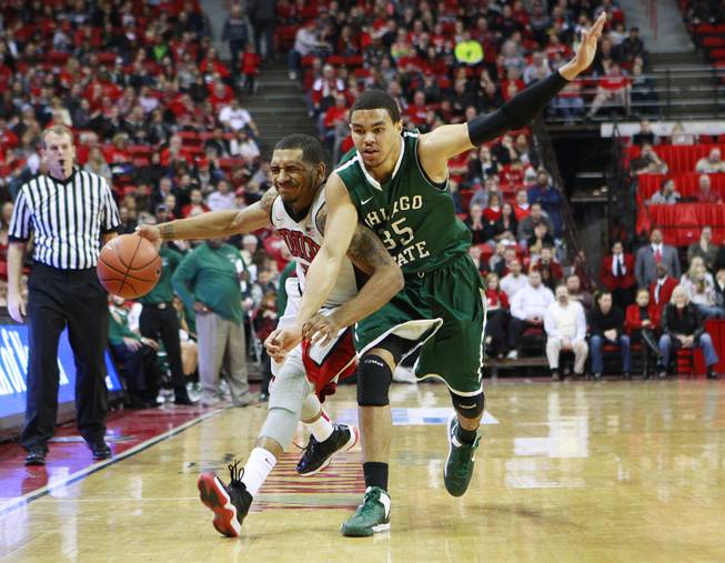 UNLV guard Anthony Marshall is defended by Chicago State guard Clarke Rosenberg during their game Thursday, Jan. 3, 2013 at the Thomas & Mack Center. UNLV won the game 74-52.