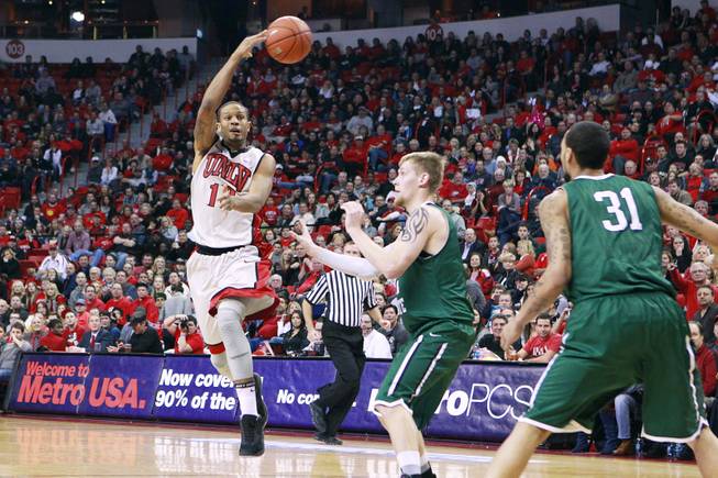 UNLV guard Bryce Dejean-Jones makes a no-look pass that would result in a turnover to Chicago State during their game Thursday, Jan. 3, 2013 at the Thomas & Mack Center. UNLV won the game 74-52.