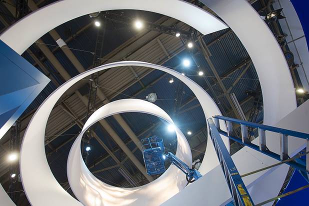 A lighting technician prepares the Casio booth for the International CES show at the Las Vegas Convention Center in Las Vegas, Nevada January 4, 2013. The annual CES electronics technology trade show is expected to cover 1.85 million square feet of exhibition space and attract 150,000 attendees. The show begins January 8.