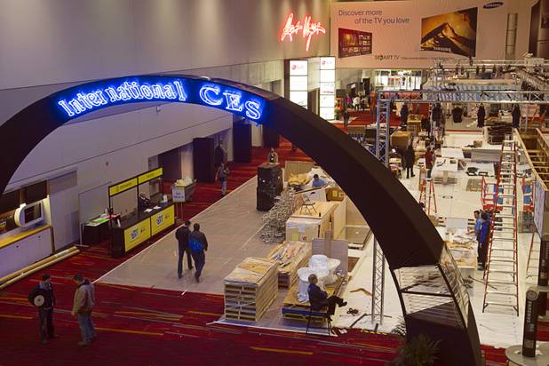 Workers prepare the Las Vegas Convention Center lobby for the International Consumer Electronics Show in Las Vegas on Saturday, Jan. 5, 2013. CES is expected to cover 1.85 million square feet of exhibition space and attract 150,000 attendees. The show begins Jan. 8.