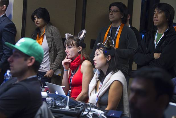 Silvie Hibdon, left, and Sandra Persing, of Blueprint Fit, listen to a presentation during a 26-hour innovation Hackathon at the Palms Saturday, January 5, 2013. Blueprint Fit develops corporate wellness programs. More than 200 innovators competed for $125,000 in cash and prizes as they tried to develop the mobile apps of tomorrow. The event is a prelude to the annual AT&T Developer Summit .