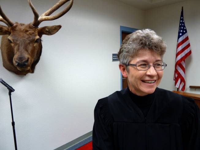 Kim Wanker is a judge who puts some miles on her car. Nevada’s 5th District judge takes a monthly circuit trip hundreds of miles to some courthouses that haven’t changed in a century. Here, Judge Wanker poses with a furry character whose head hangs inside the courthouse in Tonopah.
