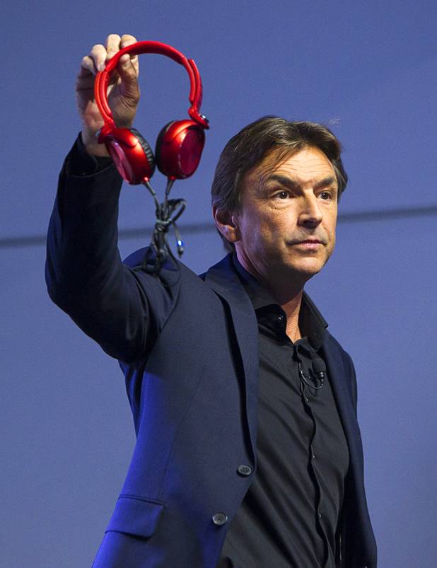 Phil Molyneux, president and COO of Sony Electonics Inc., displays  Next Generation X headphones during a Sony news conference at the 2013 International CES in the Las Vegas Convention Center Monday, January 7, 2013.
