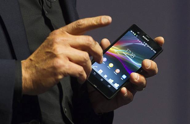Phil Molyneux, president and COO of Sony Electronics Inc., holds a Sony Xperia Z smart phone during a Sony news conference at the 2013 International CES in the Las Vegas Convention Center Monday, January 7, 2013.