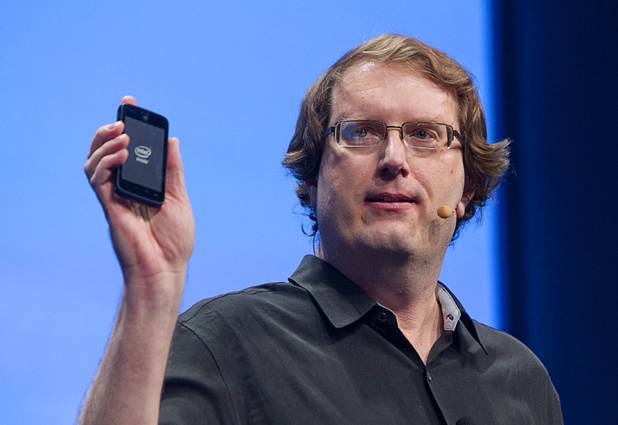 Mike Bell, vice president on Intel's mobile and communications group, holds a smart phone powered by an Intel processor at an Intel press conference during the 2013 International CES in the Mandalay Bay Convention Center Monday, January 7, 2013. Intel announced improvements to its processors including one with "all day" battery life. Intel also announced the availability of live and on-demand pay TV content to Intel devices.