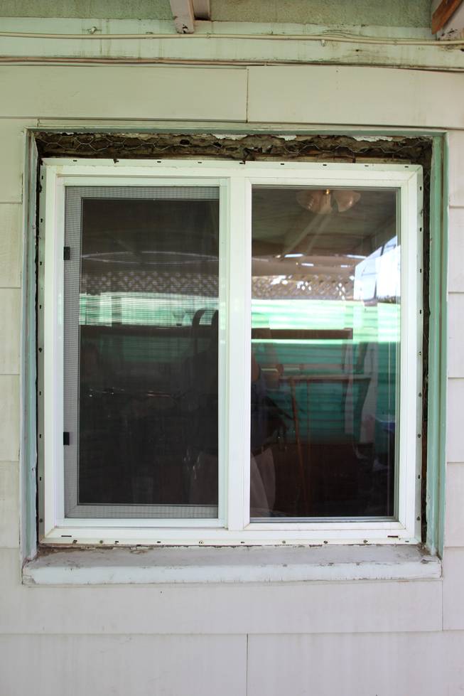 Tobie Ortiz's Henderson house Tuesday, Jan. 8, 2013 that she bought out of foreclosure has a number of replacement windows lacking trim.