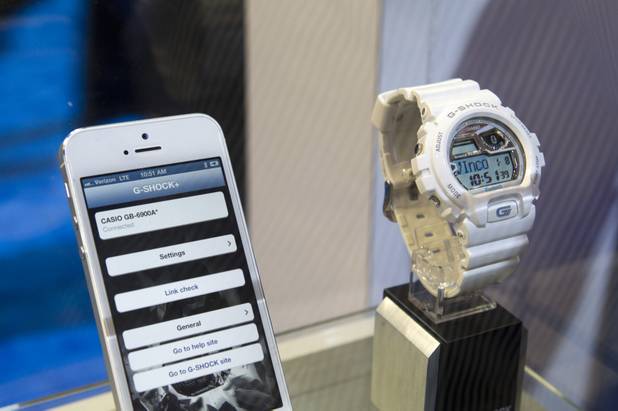 A Casio G-Shock Bluetooth watch is displayed during the first day of the 2013 International CES in the Las Vegas Convention Center Tuesday, Jan. 8, 2013. The $180.00 watch synchs with phones that have Bluetooth 4.0 or above, presently iPhone 4s and 5, and can alert the wearer to incoming emails, text messages and phone calls. It also has a phone find feature and a walk-away warning if the phone and the watch are separated a a certain distance. STEVE MARCUS