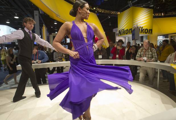 Dancers Andrew Winnet and Anya Fuchs perform in a booth featuring Nikon 1 cameras during the first day of the 2013 International CES in the Las Vegas Convention Center Tuesday, Jan. 8, 2013. STEVE MARCUS