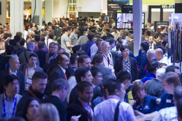 Show-goers crowd an aisle during the first day of the 2013 International CES in the Las Vegas Convention Center Tuesday, Jan. 8, 2013. 