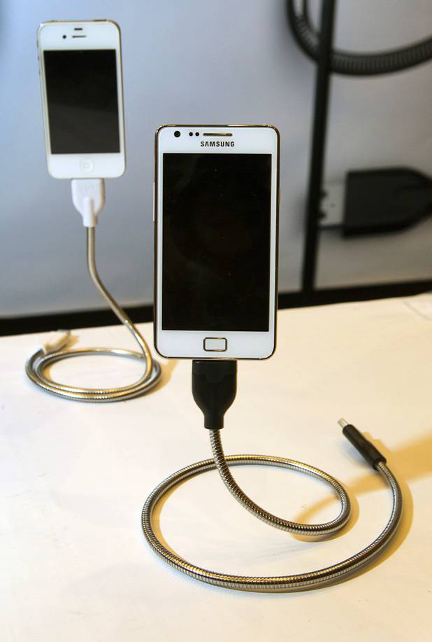 Fuse Chicken USB charging cables are displayed during the 2013 International CES Wednesday, January 9, 2013. The flexible cables double as a stand. The $30 cable is available through online retailers.