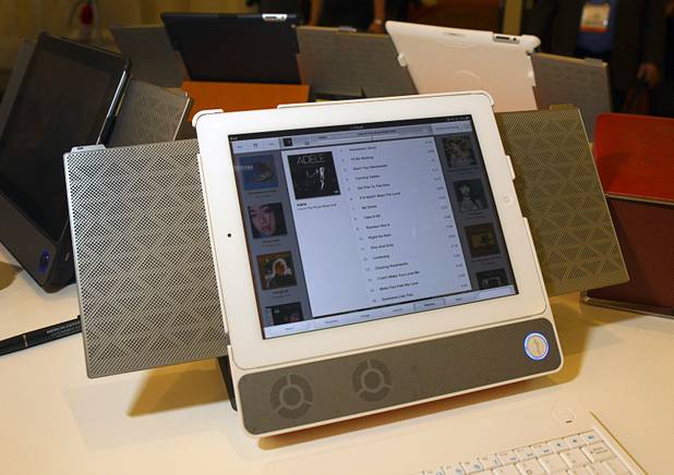 The Boompack for iPad is displayed in the In2uit booth during the 2013 International CES Wednesday, January 9, 2013. The system features flat electrostatic speakers on the sides, sub-woofers and a microphone below, and runs on a 12-15 hour rechargeable battery. The side speakers fold flat into the Boompack case when not in use.