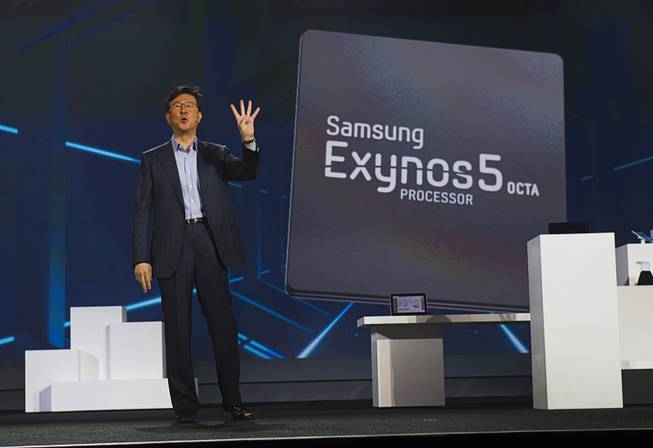 Stephen Woo, president of Device Solutions Business for Samsung Electronics, talks about the new Samsung Exynos 5 Octa processor during a keynote address at the 2013 International CES Wednesday January 9, 2013. The processor is faster and uses less power than Samsung's previous models, he said.