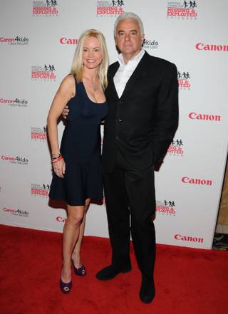 Lisa Mesioh and John O'Hurley arrive at the red carpet for the 2013 Canon USA and National Center for Missing and Exploited Children benefit at the Bellagio on Wednesday, Jan. 9, 2013.