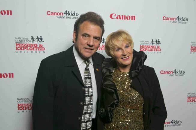 Tony Sacca and his wife arrive at the red carpet for the 2013 Canon USA and National Center for Missing and Exploited Children benefit at the Bellagio on Wednesday, Jan. 9, 2013.