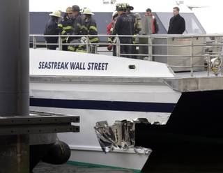 New York City firefighters walk the deck of the Seastreak Wall Street ferry in New York,  Wednesday, Jan. 9, 2013. 