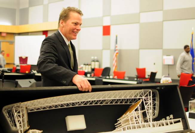 Majestic Realty partner Craig Cavileer packs up a cutaway model of the UNLV Now stadium project after the Nevada System of Higher Education's Board of Regents meeting on Friday, Jan. 11, 2013.