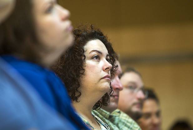 A woman listens to child psychologist and author Michael Thompson during a free parenting workshop at the Adelson Educational Campus in Summerlin Sunday, January 13, 2013.