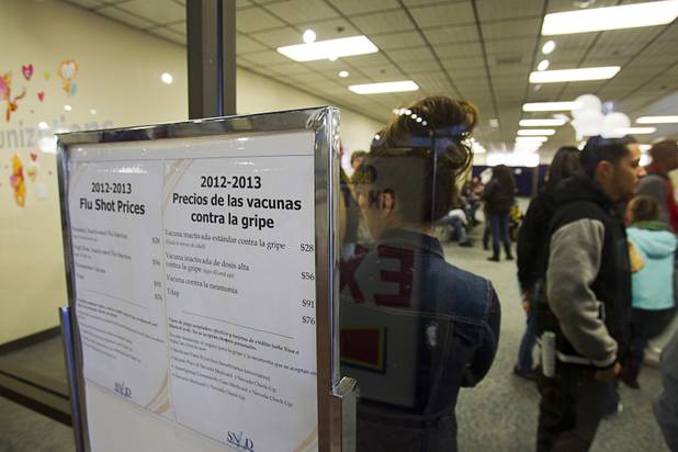People wait for flu shots  and other vaccinations at the Southern Nevada Health District's immunization clinic, 330 S. Valley View Blvd. at Meadows Lane, Monday, January 14, 2013.