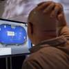 Casino industry representatives and exhibitors watch an online poker game during industry's G2E conference, Tuesday, Oct. 4, 2011, in Las Vegas.