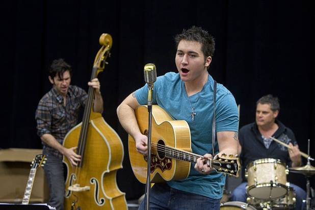 Tyler Hunter, center, performs as Elvis Presley during a rehearsal for "Million Dollar Quartet" in a warehouse near The Orleans on Tuesday, Jan. 15, 2013. "Million Dollar Quartet" is based on a performance by Johnny Cash, Jerry Lee Lewis, Carl Perkins and Elvis Presley at Sun Records in Memphis on Dec. 4, 1956. The new show begins at Harrah's Las Vegas on Feb. 4.