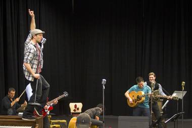 Martin Kaye, left, performs as Jerry Lee Lewis during a rehearsal for “Million Dollar Quartet” in a warehouse near The Orleans on Tuesday, Jan. 15, 2013. “Million Dollar Quartet” is based on a performance by Johnny Cash, Jerry Lee Lewis, Carl Perkins and Elvis Presley at Sun Records in Memphis on Dec. 4, 1956. The new show begins at Harrah’s Las Vegas on Feb. 4.