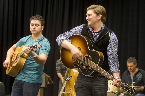 Tyler Hunter, left, as Elvis Presley and Benjamin D. Hale as Johnny Cash perform during a rehearsal for "Million Dollar Quartet" in a warehouse near The Orleans on Tuesday, Jan. 15, 2013. "Million Dollar Quartet" is based on a performance by Johnny Cash, Jerry Lee Lewis, Carl Perkins and Elvis Presley at Sun Records in Memphis on Dec. 4, 1956. The new show begins at Harrah's Las Vegas on Feb. 4.