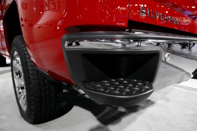 A 2014 Chevrolet Silverado with a step in the rear bumper is displayed at media previews for the North American International Auto Show in Detroit, Tuesday, Jan. 15, 2013.