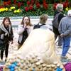Tourists take photos of the Bellagio Conservatory & Gardens Chinese New Year display Tuesday, Jan. 15, 2013.