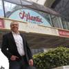 In this March 13, 2012, file photo, Michael Frawley, chief operating officer of the Atlantic Club, poses in front of the Atlantic City casino. The parent company of PokerStars, the online gambling site, wants to buy the Atlantic Club, and has asked New Jersey casino regulators for permission.
