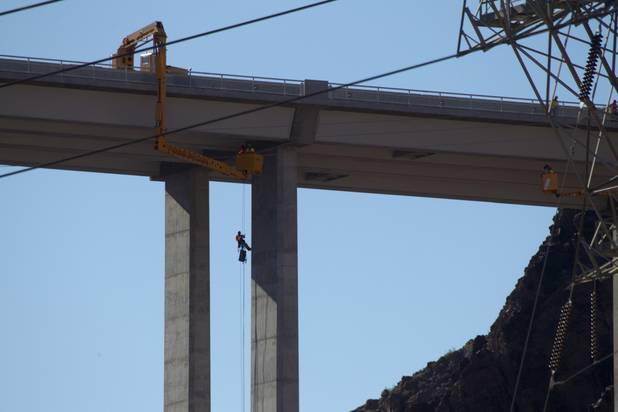 A bridge inspector rappels down a column during a safety inspection of the Mike O'Callaghan-Pat Tillman Memorial Bridge Wednesday, January 16, 2013.