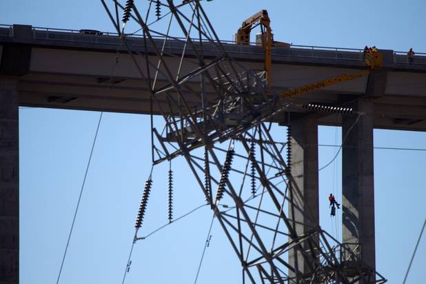 A bridge inspector rappels down a column during a safety inspection of the Mike O'Callaghan-Pat Tillman Memorial Bridge Wednesday, January 16, 2013.