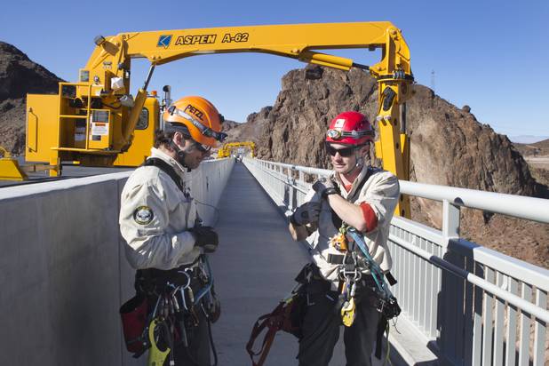 Trask Bradbury, left, a safety-rescue technician, and Frank Block, a Stantec engineer/bridge inspector, are shown during a safety inspection of the Mike O'Callaghan-Pat Tillman Memorial Bridge Wednesday, January 16, 2013.