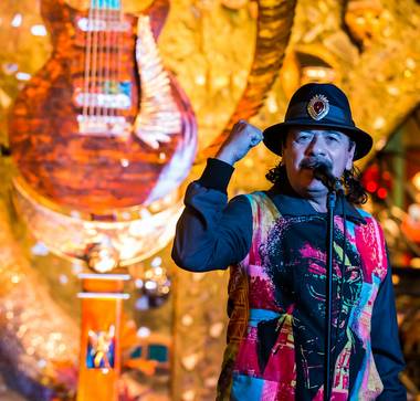 Artist Dale Evers’ 13-foot guitar sculpture for Carlos Santana and House of Blues is unveiled at HOB in Mandalay Bay on Wednesday, Jan. 16, 2013. Santana, Evers (in black) and Paul Reed Smith (in striped shirt) of PRS Guitars attended the unveiling.