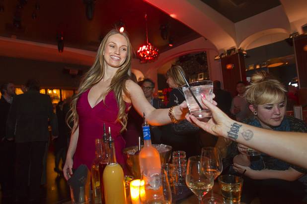Cocktail waitress and sports handicapper Kelly Stewart serves a drink at Hyde Bellagio on Thursday, Jan. 17, 2013.