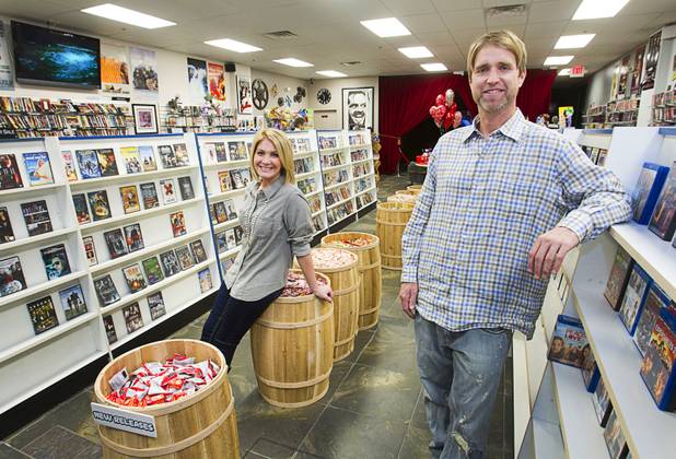Trevor Layne and his girlfriend Katie Crispell pose at Movies & Candy, 10895 S. Eastern Ave., Thursday, January 17, 2013. Layne opened the video shop last November when his house started overflowing with movies.