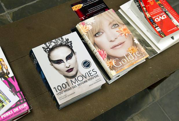 Movie reference books are available to customers at Movies & Candy, 10895 S. Eastern Ave., Thursday, January 17, 2013. Movie fan Trevor Layne opened the video shop last November when his house started overflowing with movies.