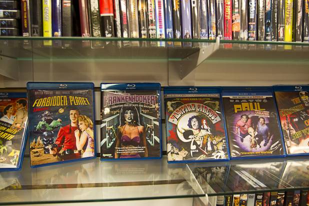Science fiction films are displayed at Movies & Candy, 10895 S. Eastern Ave., Thursday, January 17, 2013. Movie fan Trevor Layne opened the video shop last November when his house started overflowing with movies.