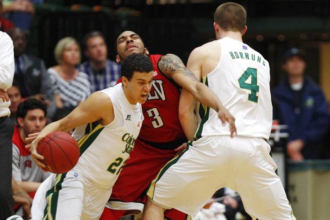 UNLV guard Anthony Marshall is screened by Colorado State forward Pierce Hornung as guard Dorian Green drives to the basket during their game Saturday, Jan. 19, 2013 at Moby Arena in Ft. Collins, Colorado.