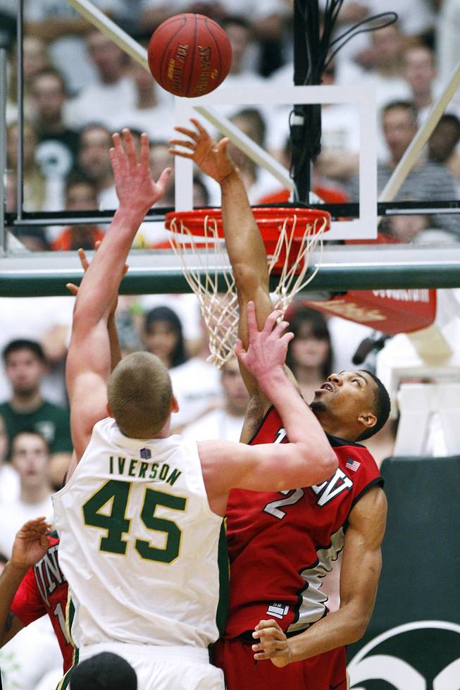UNLV forward Khem Birch blocks a shot by Colorado State  forward Colton Iverson during their game Saturday, Jan. 19, 2013 at Moby Arena in Ft. Collins, Colo. Colorado State won the game 66-61.