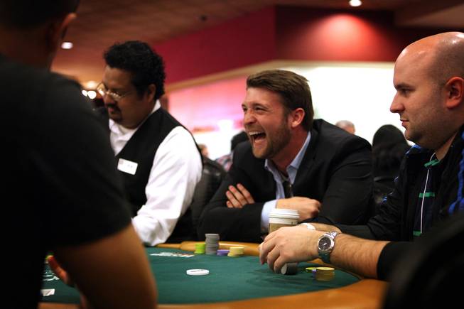 Mark Peters of Santa Clara University plays poker during the MBA Poker Championship and Recruitment Weekend at Planet Hollywood in Las Vegas on Saturday, January 19, 2013.
